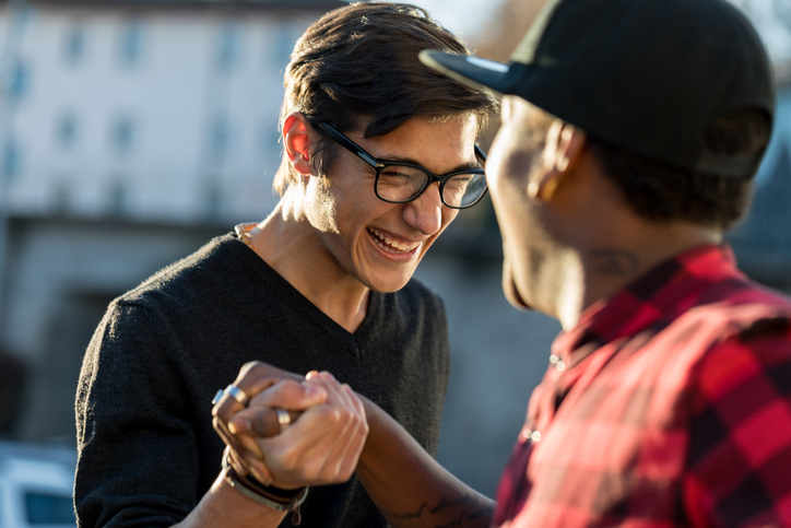 Two_men_grasping_hands